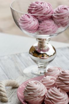 Color zephyrs in glass jar. Wedding cande bar. pink end white. zephyr close up on a rustic background. 
