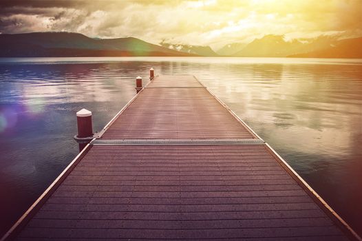 Montana Glacier Lake Scenery. Lake McDonald Wooden Deck Scenic Point. Glacier National Park, Montana, United States.