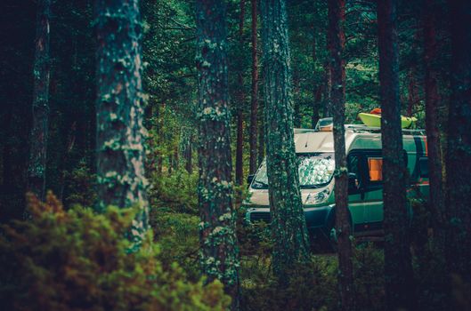 RV Forest Camping. Motorcoach RV Class B Boondocking in Forest. Camper Van Camping.