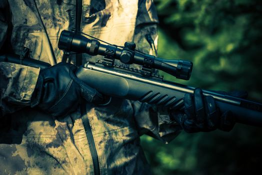Hunter Rifle Closeup. Poacher Hunting Concept Photo.