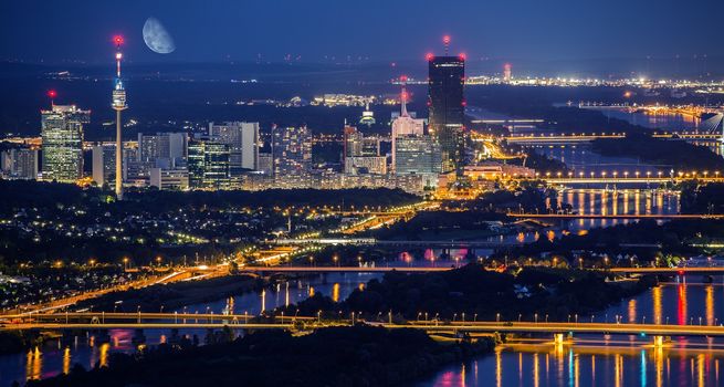 Vienna Austria City Skyline at Night. Danube River Bridges and Reflections.