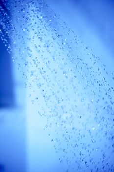 Shower Water Drops. Bathroom Refreshing Theme. Vertical Photo.