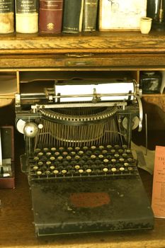 Vintage Writer Desktop with Vintage Typewriter Machine. Vertical Photo
