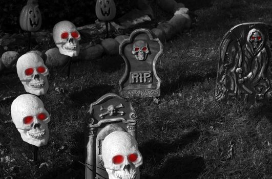 Halloween Graveyard. Halloween Darkness. Skulls with Red Eyes. Halloween Dark Photo Collection