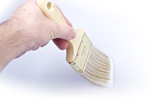 Painting Time. Male Hand and Brush