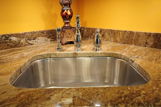 Silver Sink and Granite Countertop. Kitchen Interiors