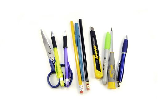 Desktop Set. Pens, Knife, Scissors, Screwdriver. Separated White Background