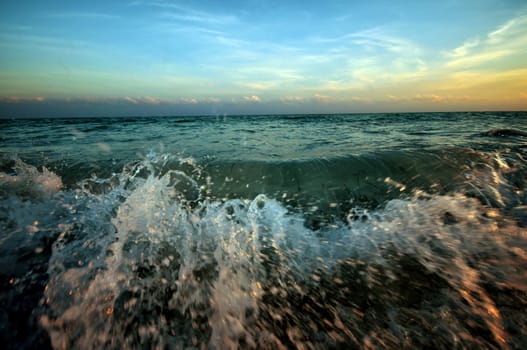 Ocean Wave. Fun on the Beach. Sunset on the Beach