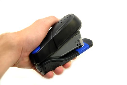 Black Plastic Office Stapler in Hand. White Separated Background.