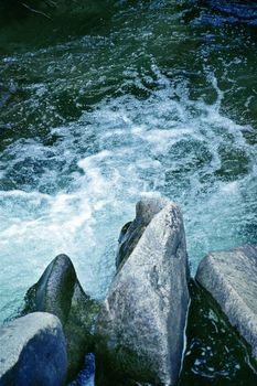 Cold Mountain River - Colorado Rocky Mountains. River and Rocks. Vertical Photo.