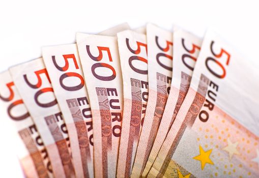 Fifty Euros Pile. European Union Currency. 50 Euro Bills Pile Isolated on White. Closeup Horizontal Photography