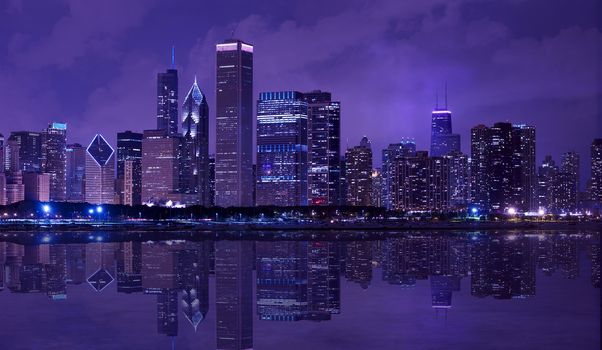 City of Chicago - Night Skyline of Downtown Chicago with Lake Michigan Reflections. Horizontal Panoramic Photography.