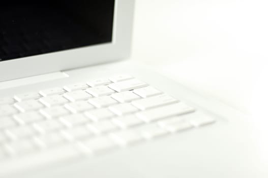 White Laptop Computer on the White Background.