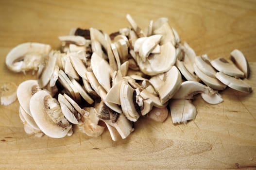 Sliced Mushrooms on the Wood Kitchen Table