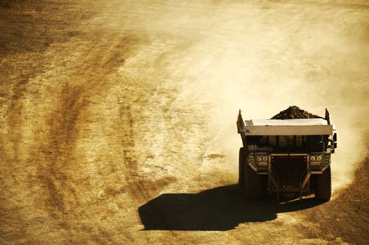 Huge Dump Truck in the Mining Area