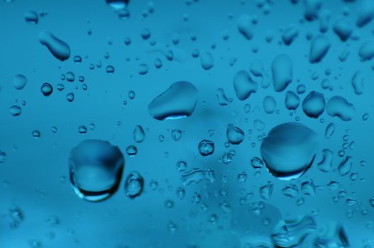 Blue Drops on the Glass. Water on the Glass