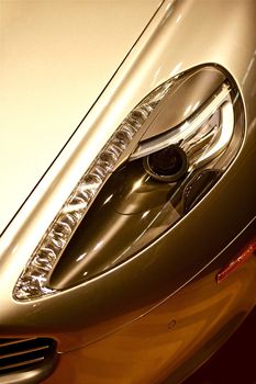 Elegant Luxury Car Headlight Closeup. Expensive Sporty Car Headlight.