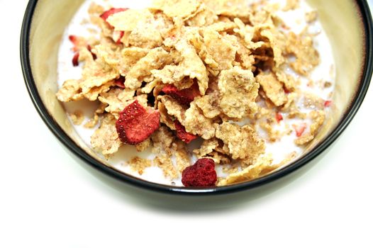 Fresh Corn Flakes with Strawberries in Milk. Healthy Breakfast. White Separated Background.