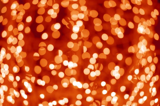 Bokeh Lights - Out of Focus Christmas Lights Background. Red-Orange Holidays Bokeh Lights.