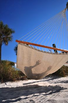 Hammock Time. Spending Lazy Time on Hammock in Tampa Florida USA. Beach Hammock. Vertical Photo