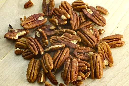 Fresh Pecans on the Wood Kitchen Board. Organic Photo Collection.
