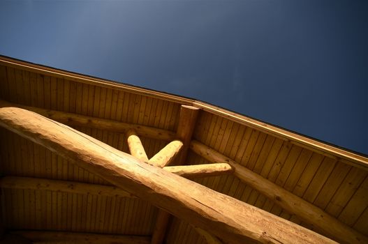 Log Roof on the Blue Sky