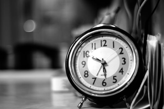 Vintage Clock on the Table. Black and White Photography.
