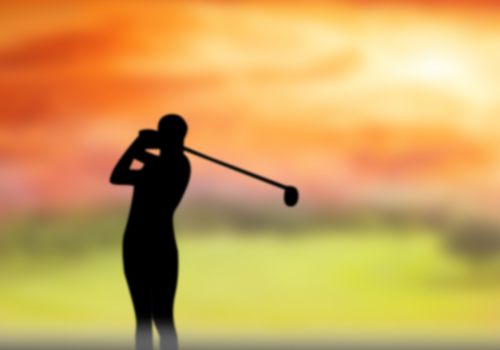 Silhouettes of athletes hit the golf ball out in front.