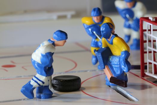 attack ice hockey match, table game macro shot