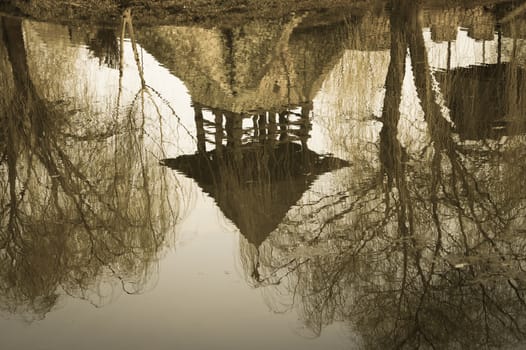 the old castle reflected in water