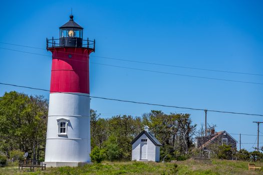 Nauset Light, officially Nauset Beach Light, is a lighthouse in Eastham, Massachusetts. It is a cast iron plate shell lined with brick and stands 48 feet high.