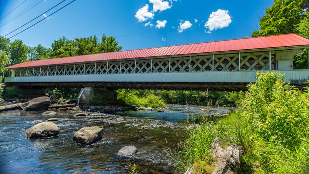 The Ashuelot Covered Bridge is a historic wooden covered bridge over the Ashuelot River on Bolton Road, just south of its intersection with NH 119 in Ashuelot, New Hampshire.