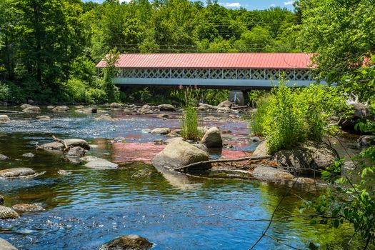 The Ashuelot Covered Bridge is a historic wooden covered bridge over the Ashuelot River on Bolton Road, just south of its intersection with NH 119 in Ashuelot, New Hampshire.