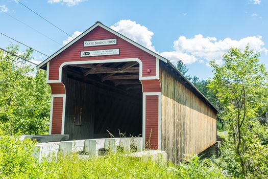 The Slate Covered Bridge is a wooden covered bridge which carries the Westport Village Road over the Ashuelot River in Westport, a village of Swanzey, New Hampshire.