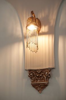 Beautiful wall decorative chandelier in the interior.