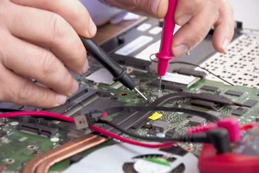 Broken computer repair with the instrument.Laptop Disassembling