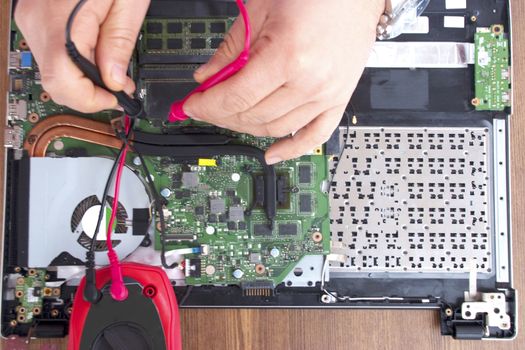 Broken computer repair with the instrument.Laptop Disassembling