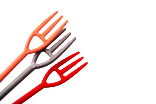 image of a three small disposlable plastic forks