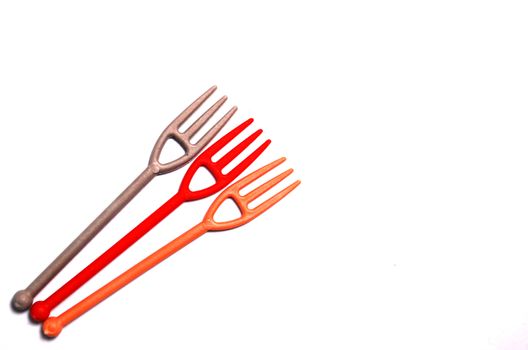 image of a three small disposlable plastic forks