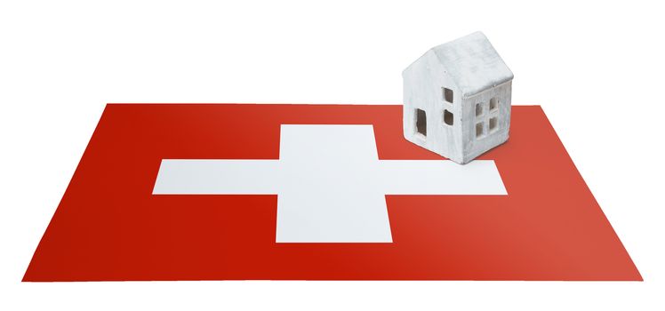 Small house on a flag - Living or migrating to Switzerland