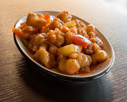 Chinese food, fried chicken stir with peppers and pineapple  in sweet source