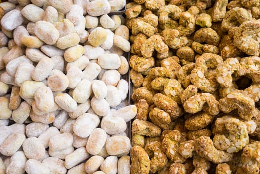 Background of typical sicilian cookies,pastries, made with  almond paste for sale in italian market.