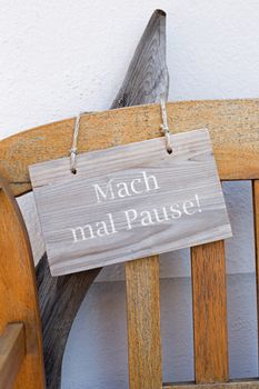 Bench and german sign with the german words for make a break