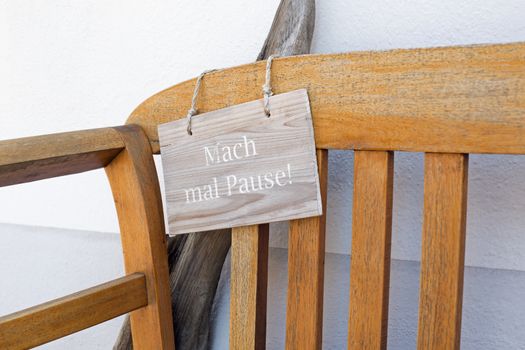 Bench and german sign with the german words for make a break