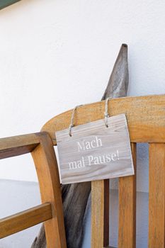 Bench and german sign with the german words for make a break