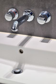 Modern faucet and sink in the bathroom
