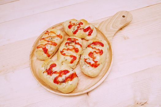 Sausage Bread with Tomato Sauce in Dish on Table Wooden