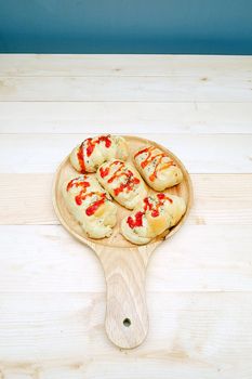 Sausage Bread with Tomato Sauce in Dish on Table Wooden