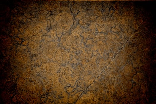 Vignetted stone wall background with lots of texture