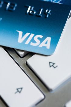 Benon, France - Feb 08, 2017: Visa Credit card on the keyboard, close up photo